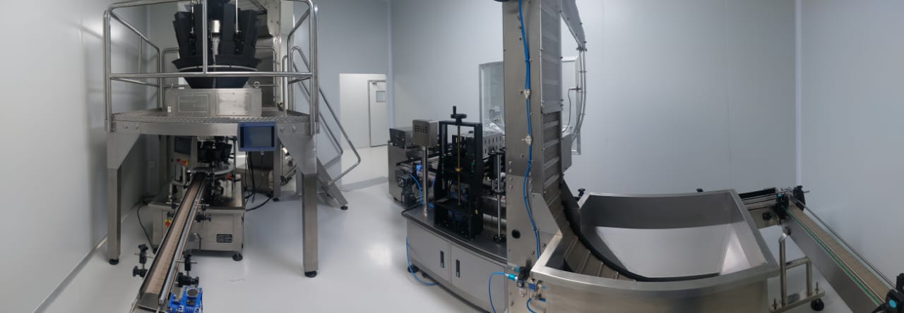 Conveyor and handling system supporting nutraceutical gummy packaging operations.