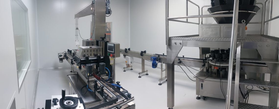 Stainless steel machinery used for large-scale gummy supplement production.