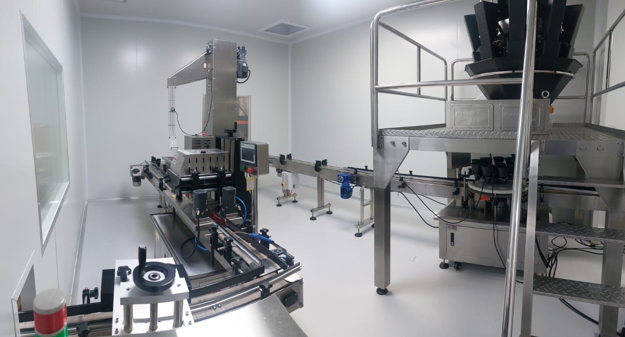 Stainless steel machinery used for large-scale gummy supplement production.